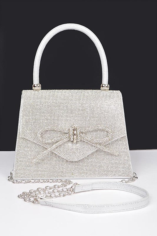 Clear and silver top-handle clutch with rhinestone bow