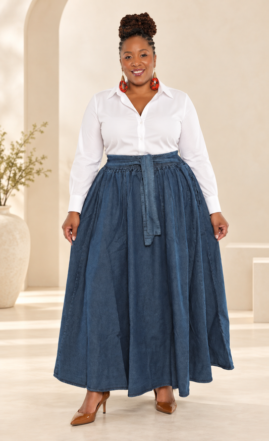 African American woman wearing a full belted denim maxi skirt styled with a white button-up shirt