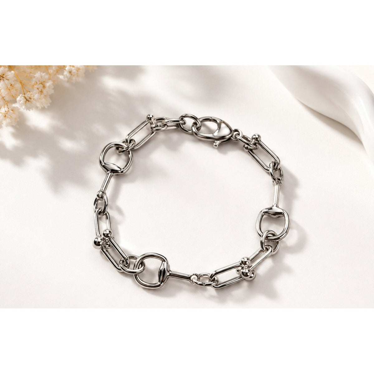 Silver mixed-link statement bracelet on satin